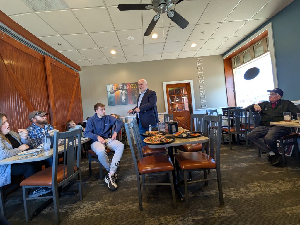US Senate candidate Jim Carlin talking in front of a crowd at Sioux Center Pizza Ranch